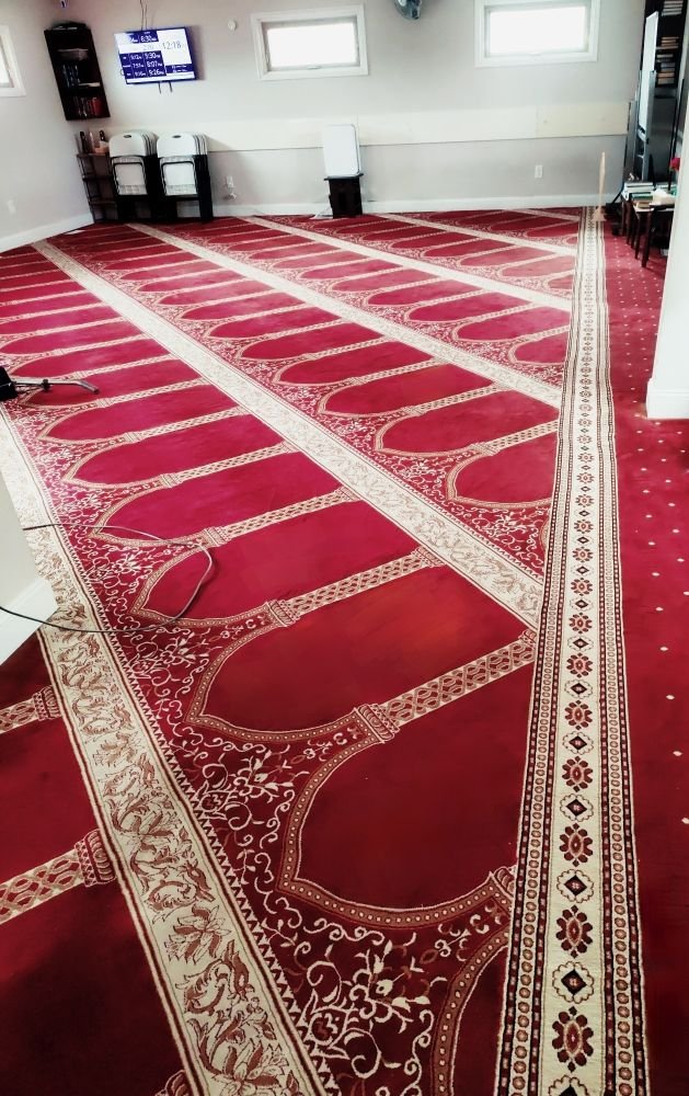 Large red patterned carpet after cleaning